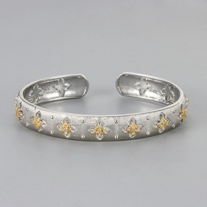 Italian style brushed silver open bangle with gold flower accents and 925 silver stamp