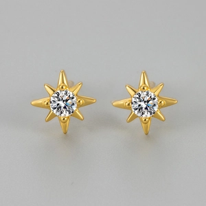 Elegant French vintage gold eight-pointed star stud earrings with central sparkling zircon