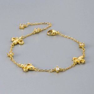 French vintage fleur-de-lis bracelet in brushed gold with sparkling zircon accents