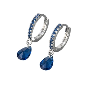 Silver drop earrings with pear-shaped blue zircon and pavé hoops on white background