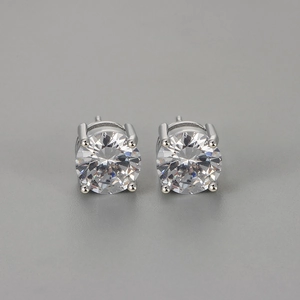 Detailed view of round-cut cubic zirconia studs with a classic four-prong silver setting