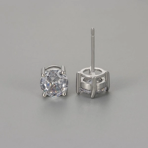 Macro detail of classic four-prong setting with brilliant round-cut cubic zirconia studs