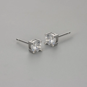 Minimalist silver four-prong stud earrings with round brilliant-cut cubic zirconia