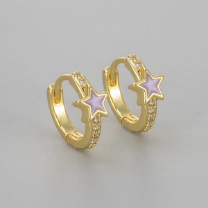 Macro shot of gold star hoop earrings with purple enamel and zircon stones