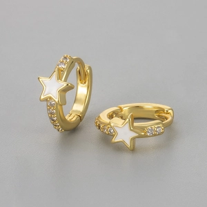 Macro view of gold-plated star hoop earrings with white enamel and clear zircons