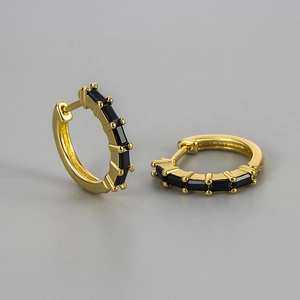 Golden huggie hoop earrings with rectangular black cubic zirconia in modern minimalist style