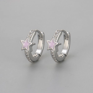 Close-up of silver star earrings with pink enamel inlay and sparkling zircon stones