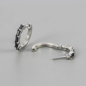 Detail of silver hoop earrings with rectangular black cubic zirconia in open and closed views
