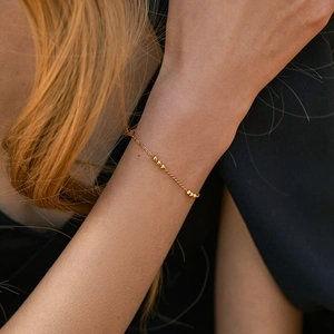 Minimalist gold geometric chain bracelet for women with elegant gold bead accents