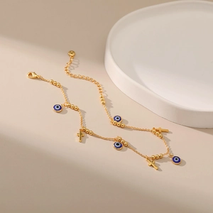 Bracelet de cheville doré 18K avec œil porte-bonheur, croix et perles bleues