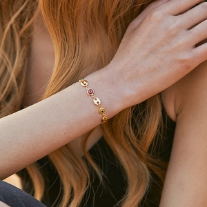 Classic 18K gold handmade bracelet with red yellow and green evil eye charms