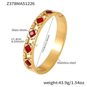 Detail showing 6.0cm inner diameter and 1.4cm width of the 18k gold plated bangle