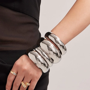 Polished silver stainless steel wide bangle set with high gloss mirror finish for women