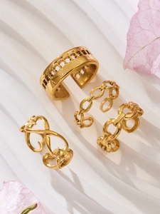 Detailed macro view of a 3-piece vintage 18K gold plated stainless steel ring set