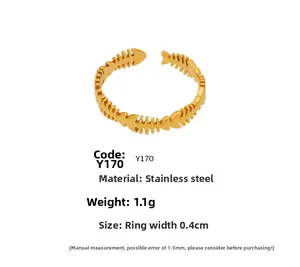 Detailed close-up of 18K gold plated fishbone ring made of stainless steel