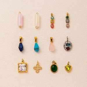 Selection of 18K gold plated stainless steel pendants with various gemstone inlays