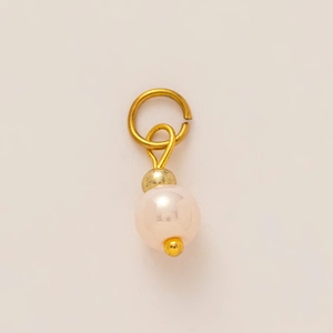 Detail view of 18K gold plated pearl skull pendant charm for DIY jewelry making