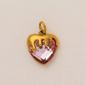 Close-up of pink heart gemstone pendant with 18K gold dripping metal frame detail