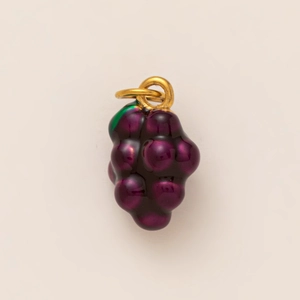 Detailed macro view of a purple grape-shaped pendant charm with 18K gold plated ring