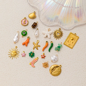 Mix of 18K gold plated celestial and shell charms for DIY jewelry making sets