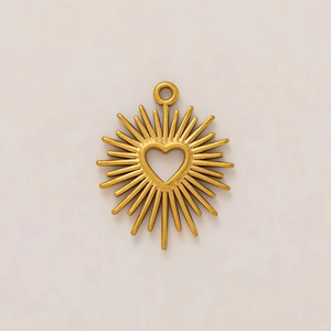 Detail of 18K gold-plated sunburst pendant with hollow heart center and textured rays