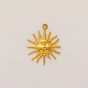 Detailed view of 18K gold plated stainless steel sun pendant with a face design