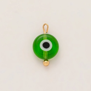 Macro shot of 18K gold plated stainless steel evil eye pendant with green resin