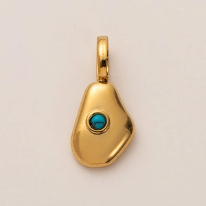 Detailed close-up of organic golden pebble pendant with an inlaid turquoise stone