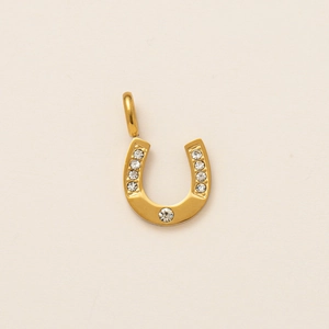 Lucky horseshoe charm in 18k gold finish featuring sparkling round crystal studs