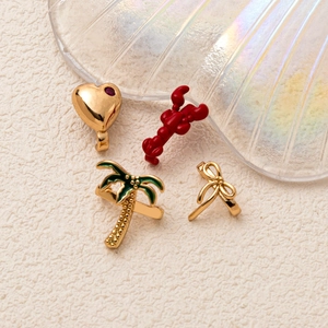 Chic 4-piece clip-on earring set with heart, lobster, palm tree and bow designs