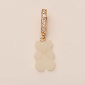 Macro shot of 14K gold plated cubic zirconia hoop with a frosted gummy bear pendant