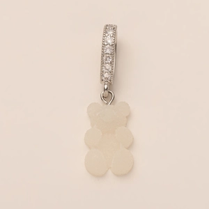 Macro detail of gummy bear charm with frosted resin texture and crystal-encrusted ring