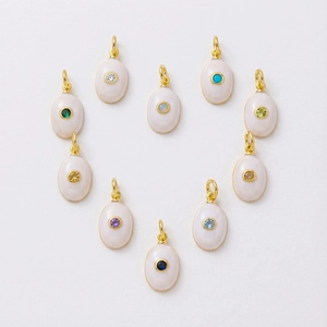 Detailed set of ten oval gold plated pendants with colorful zircon gemstones in heart layout