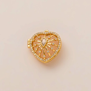 Detailed macro view of an 18K gold-plated heart locket with intricate zircon inlay
