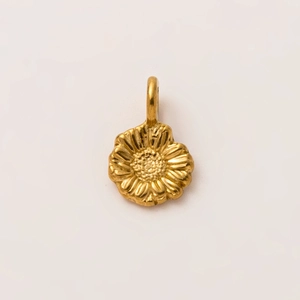 Macro shot of 18K gold plated sunflower charm with detailed floral petals and bail