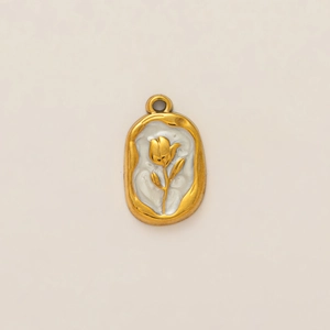 Detail of irregular 18K gold-plated oval pendant with white tulip flower relief design