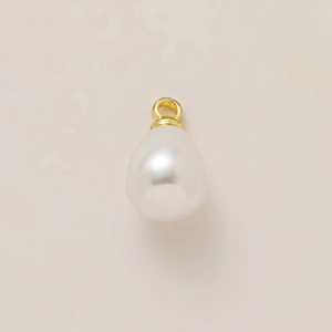 Detail showing tear-drop pearl pendant with polished 18K gold plated metal attachment