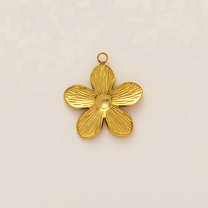 Macro detail of gold five-petal flower pendant with 18K plated matte texture
