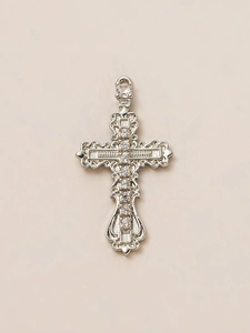 Detail of silver vintage cross pendant with white zircon stones and baroque carvings