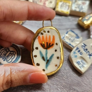 Artistic oval ceramic flower pendant with 18K gold plating and crackle glaze finish