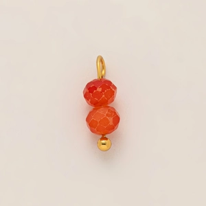 Detail of double faceted orange beads with 18K gold plated stainless steel hardware