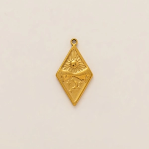 Detailed macro view of 18K gold plated rhombic pendant with sun and moon relief