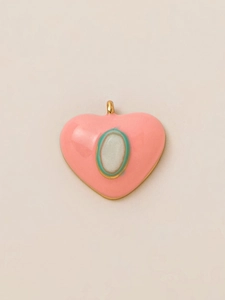 Close-up of pink enamel heart pendant with 18K gold plating and turquoise accent