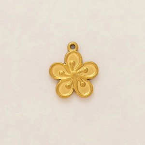 Detailed view of matte 18K gold plated flower pendant with intricate petal and stamen texture