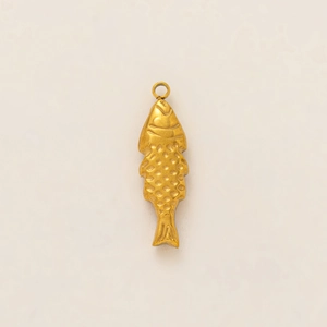 Detailed view of an antique gold fish pendant with realistic scale textures and top ring