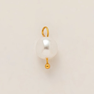 Detailed close-up of a high-luster white pearl pendant with 18K gold plated metal ring