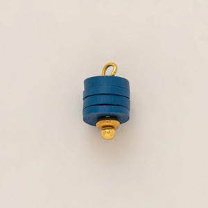 Detail of blue stacked disk pendant with 18K gold plated stainless steel ring