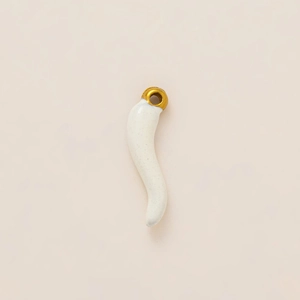 Detail of S-shaped white ceramic turtle pendant with 18K gold plated metal top hook