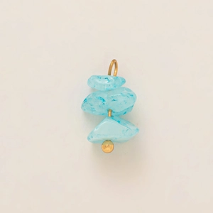 Detail of light blue stone turtle pendant with 18K gold-plated vertical wire hook