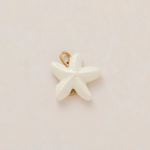 Detailed view of starfish pendant with ivory enamel texture and 18k gold plating ring
